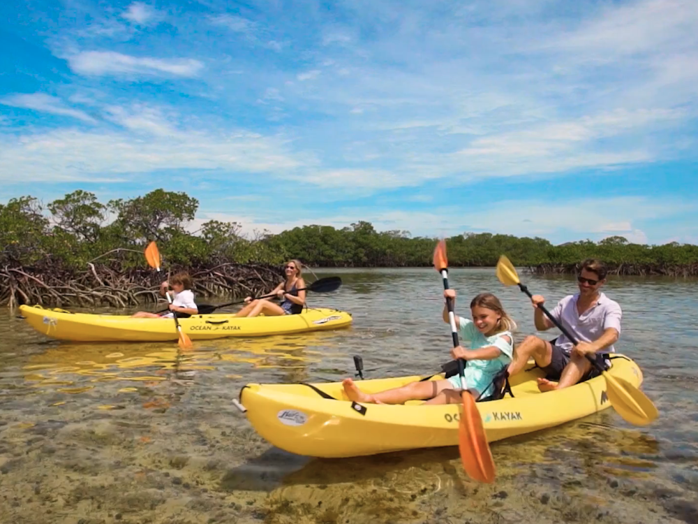 A family kayaking in Nassau Paradise Island