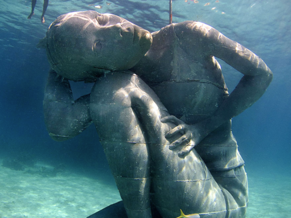 underwater statue and diver