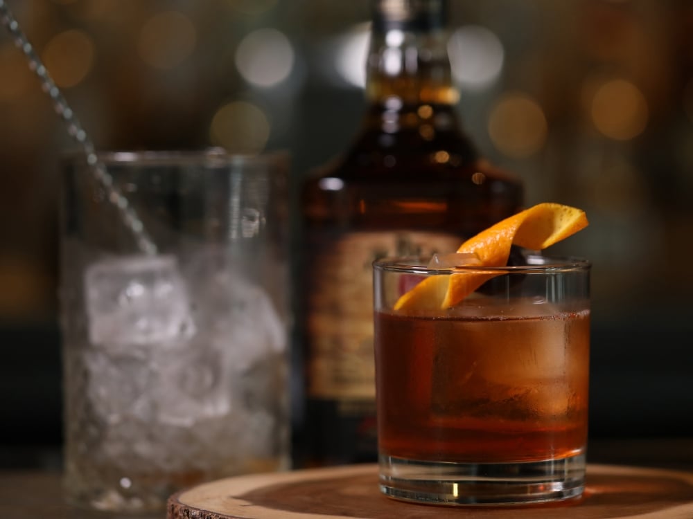 An old fashioned cocktail with an orange twist.