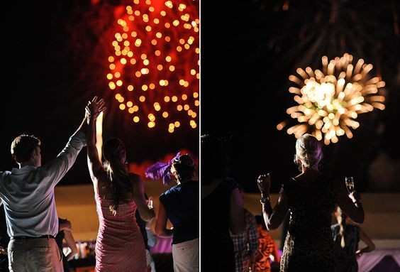 Wedding guests enjoy fireworks at a destination wedding at One&Only Ocean Club in the Bahamas.