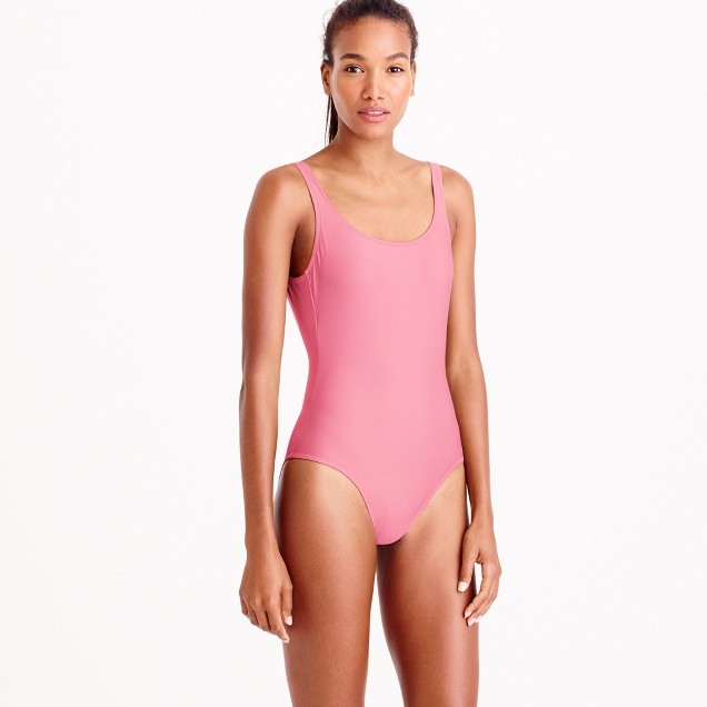 A woman in a pink one-piece swimsuit by JCrew