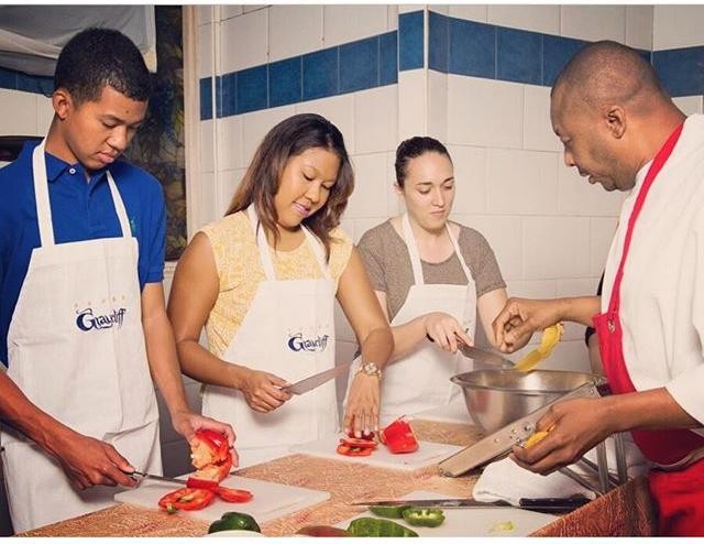 People attending a chef-guided food class.