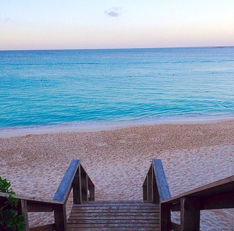 A staircase leads to a beautiful Bahamas beach