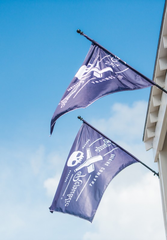 Two pirate flags hang outside the Pirates of Nassau Museum in The Bahamas. 