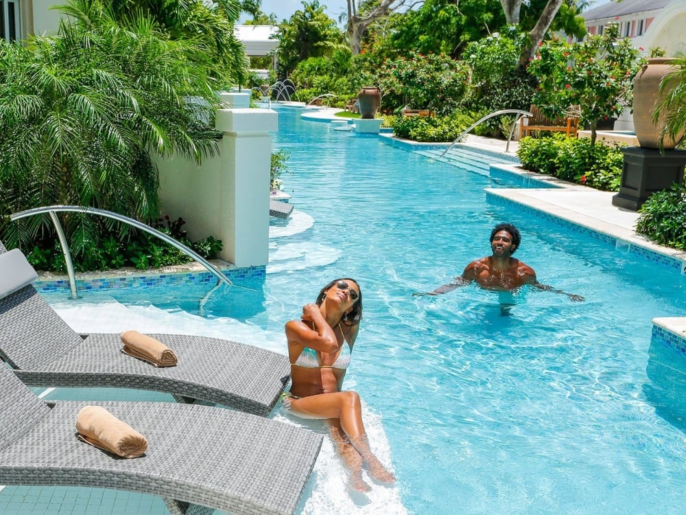 A couple in their suite at Sandals Royal Bahamian