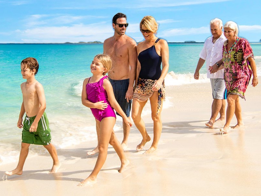 A family stroll along a beautiful beach.